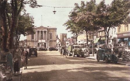 Postcard of St Albans town hall, displaying a banner advertising the pageant